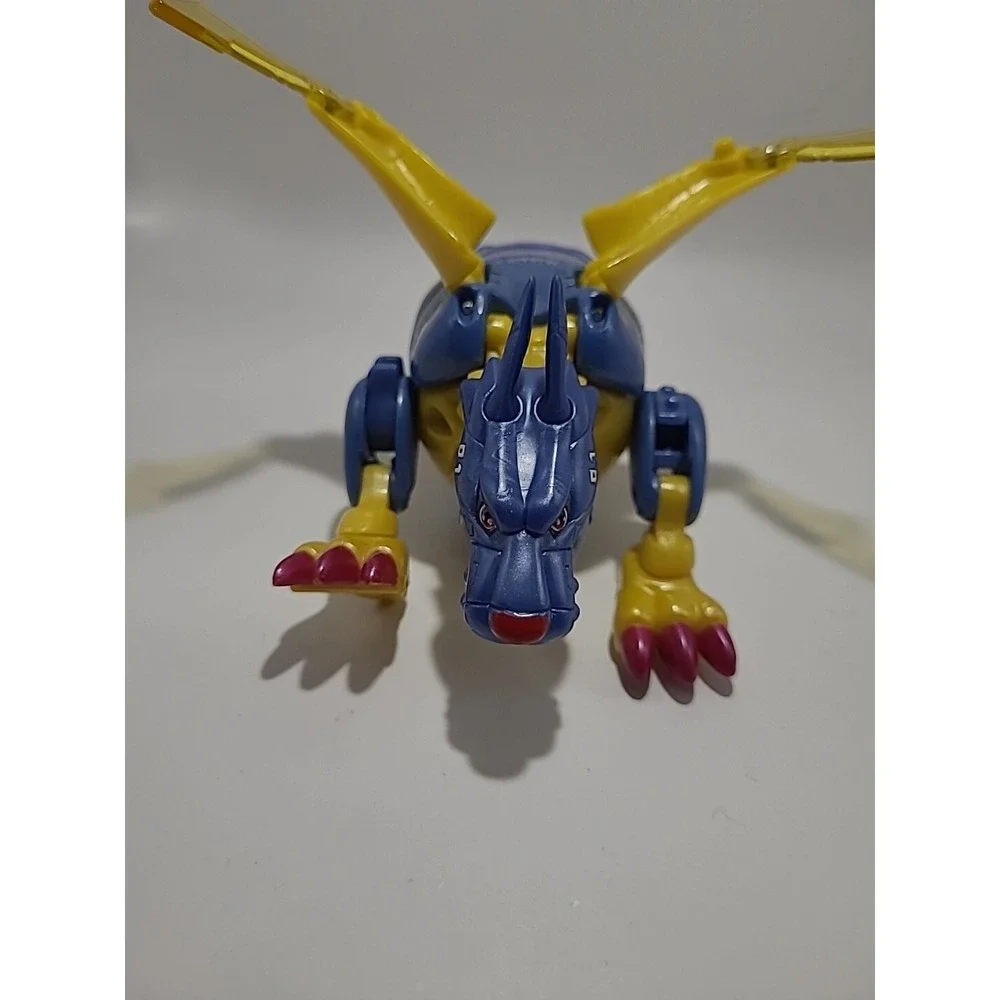 Vtg DIGIMON Digivolving Metal Garurumon digivolves to Gabumon Digimon 90%‎